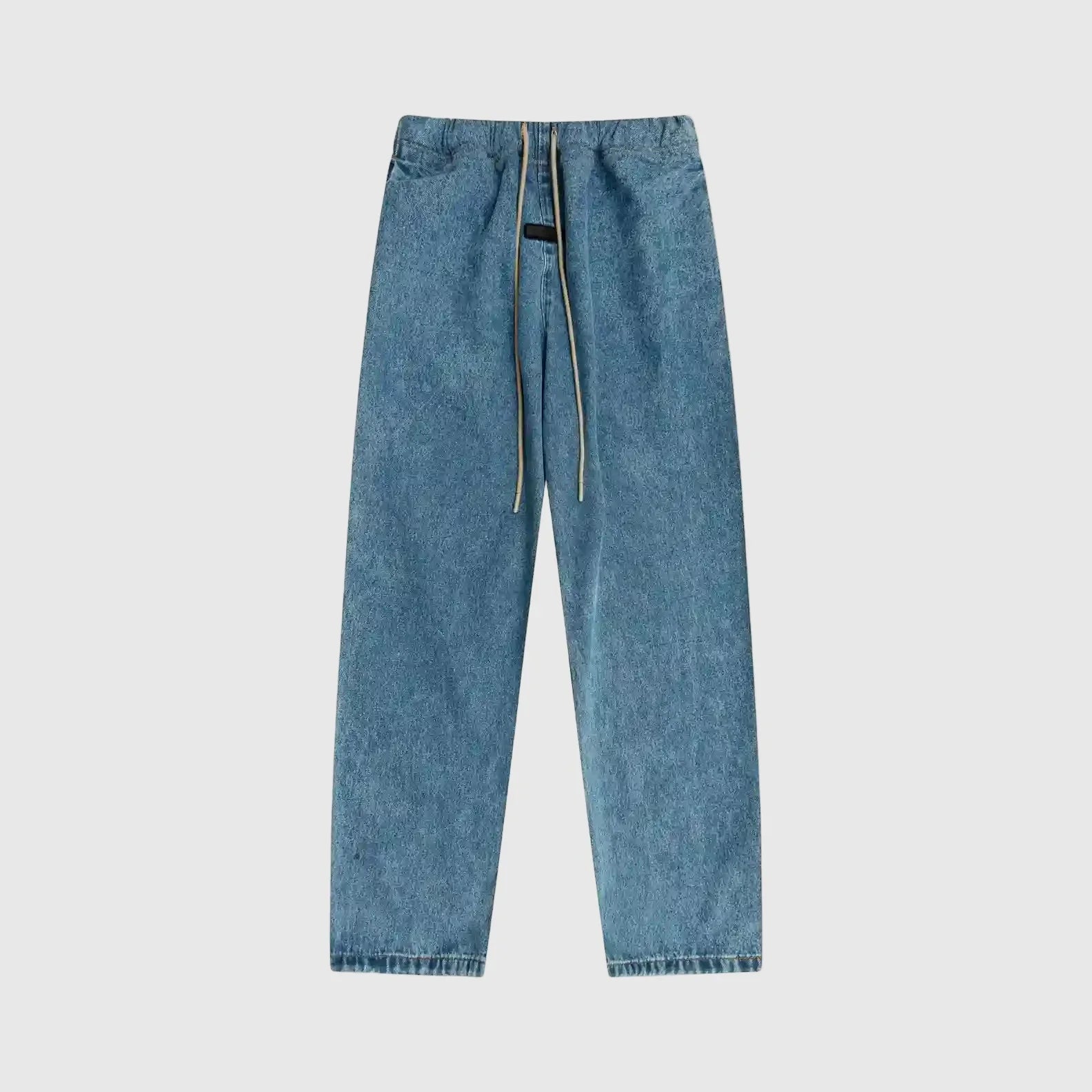 Essentials denim blue relaxed pants by Fear of God front view