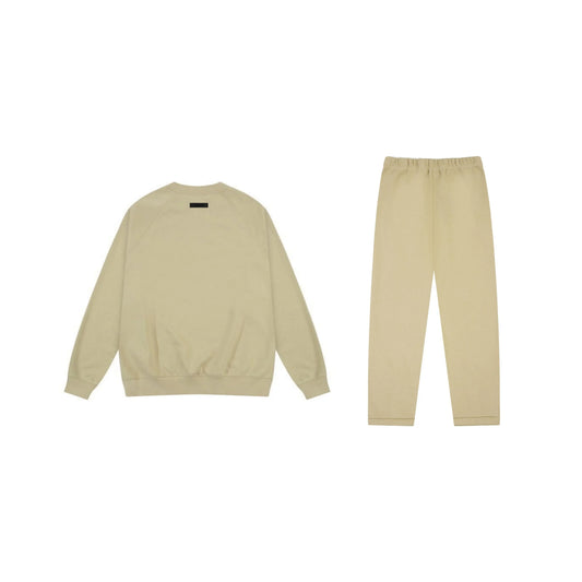 Essentials tracksuit hampton yellow angled view relaxed fit crewneck set