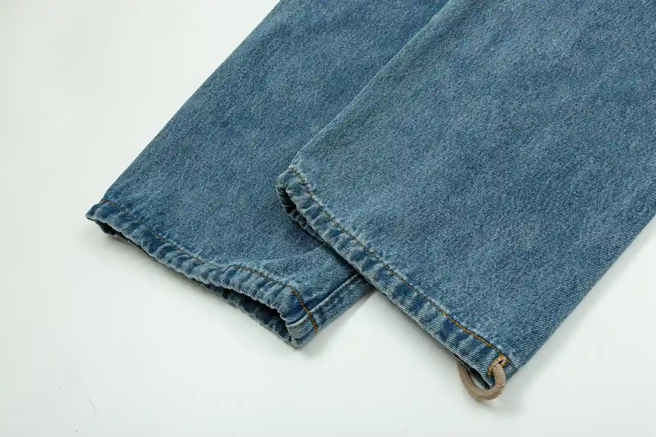 Relaxed silhouette denim blue pants by Fear of God with waistband detail