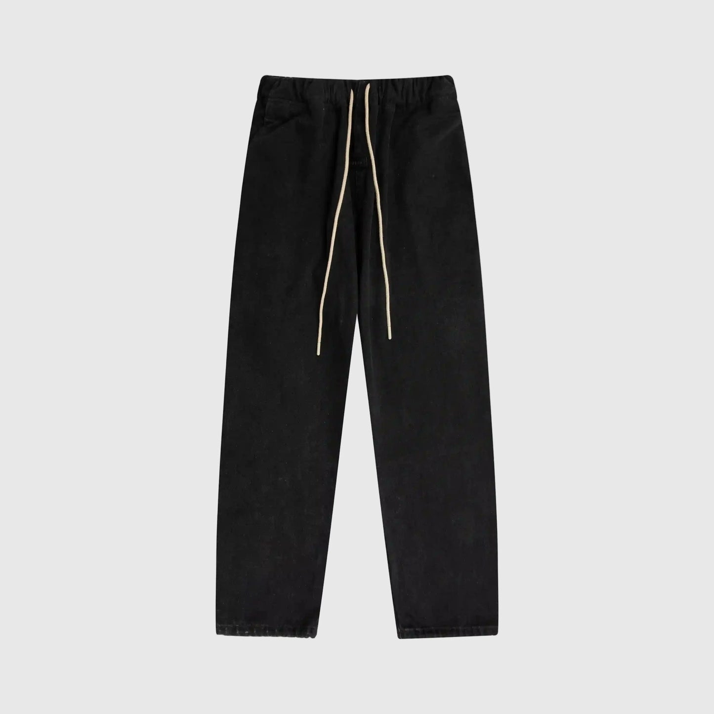 Essentials denim black relaxed pants by Fear of God front view