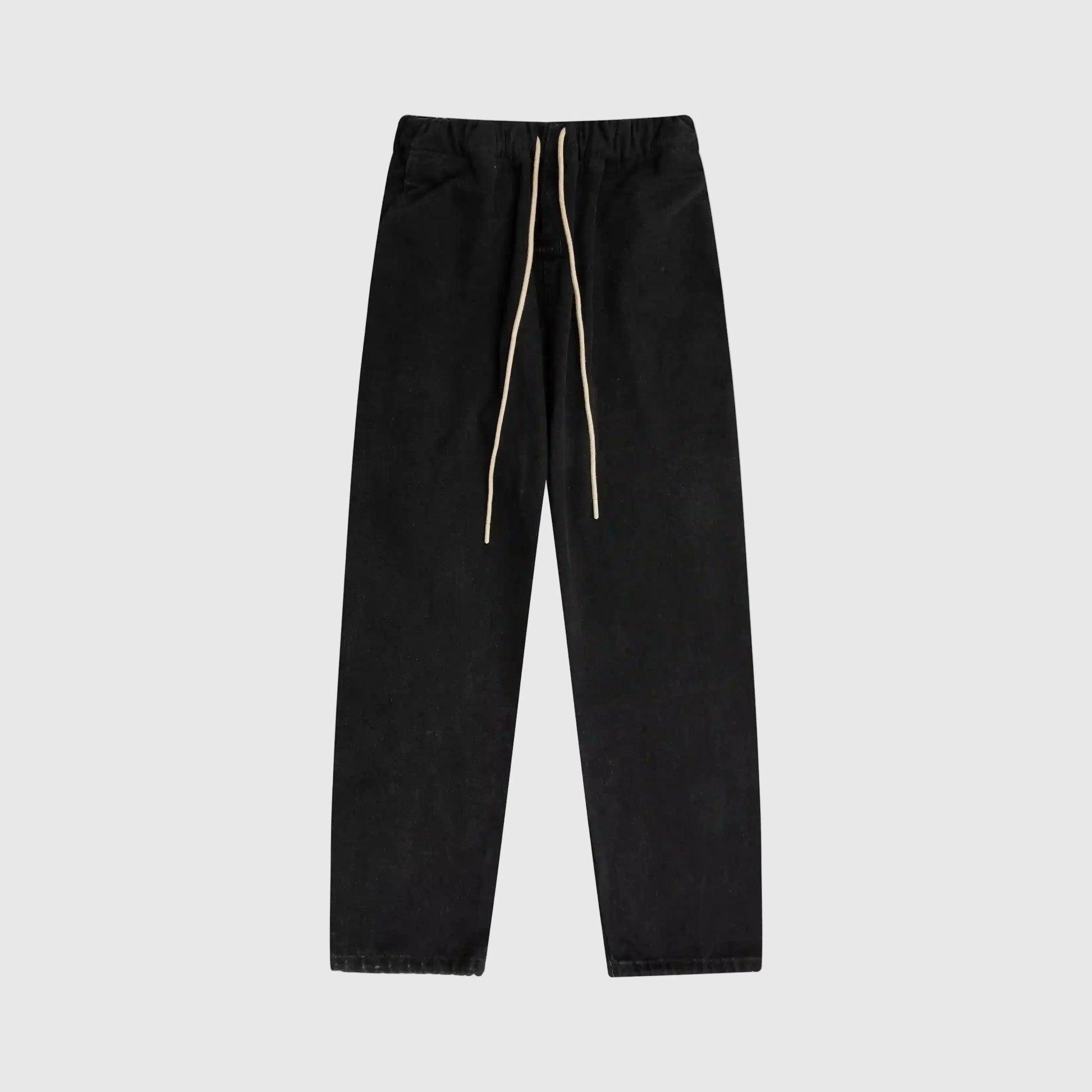 Essentials denim black relaxed pants by Fear of God front view