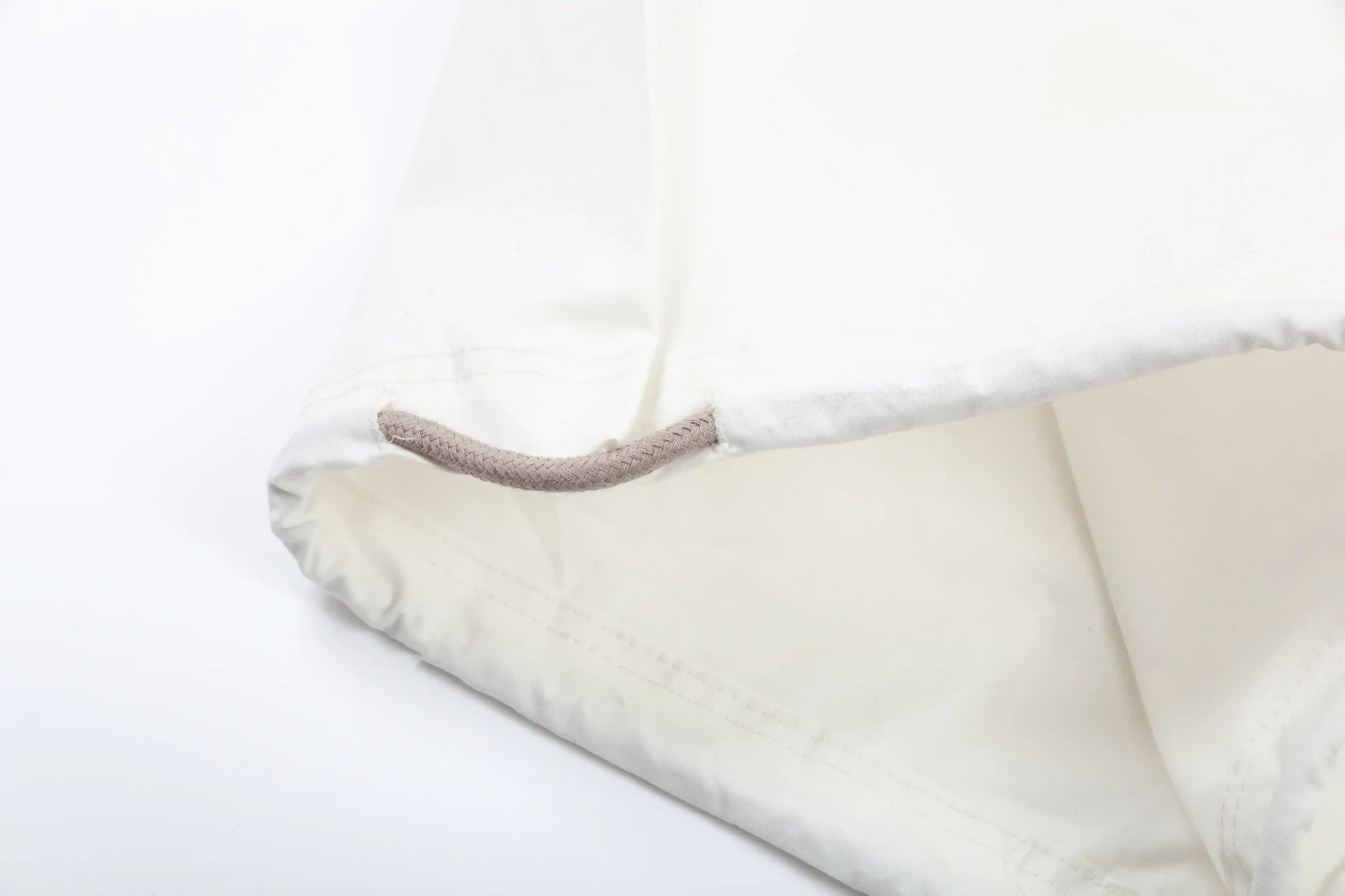 Essentials eggshell core fleece sweatpants front view by Fear Of God
