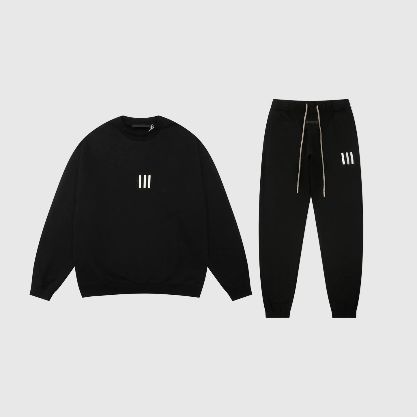 Essentials black core comfort fleece tracksuit with relaxed fit by Fear Of God