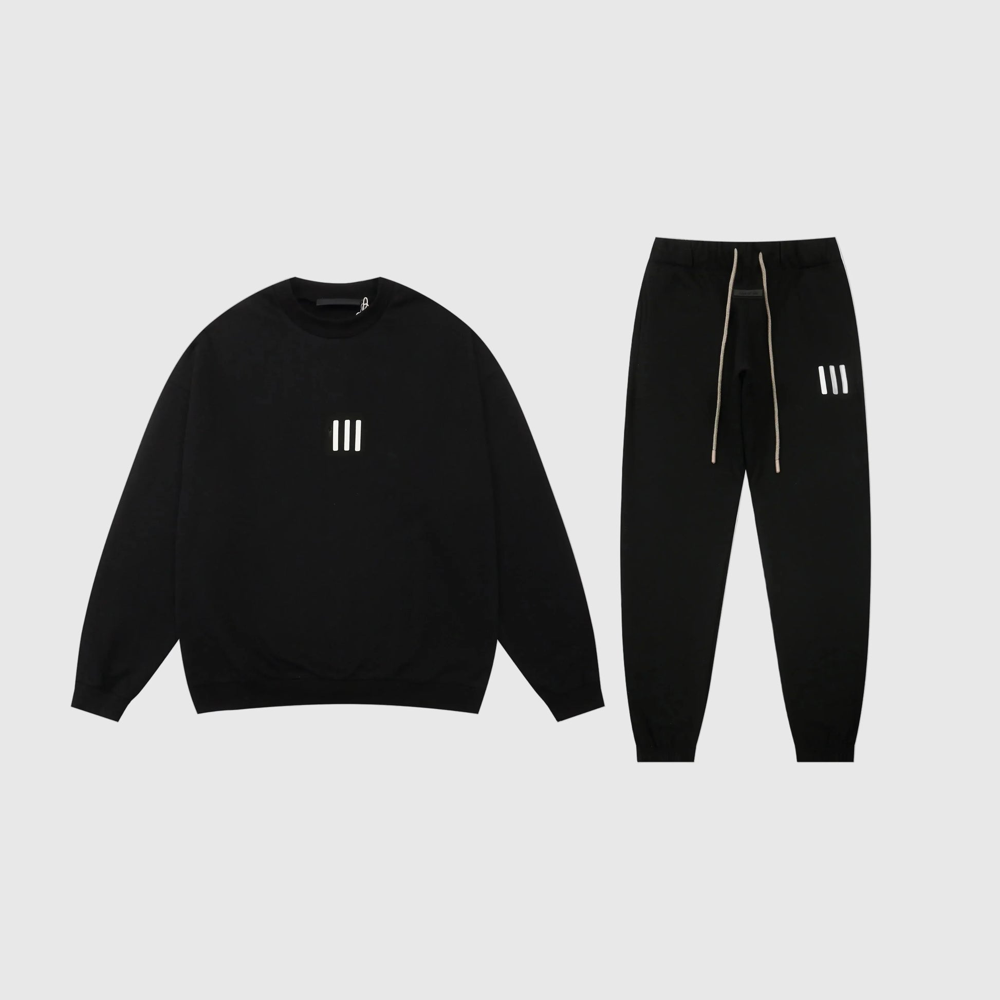 Essentials black core comfort fleece tracksuit with relaxed fit by Fear Of God