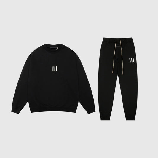 Essentials black core comfort fleece tracksuit with relaxed fit by Fear Of God