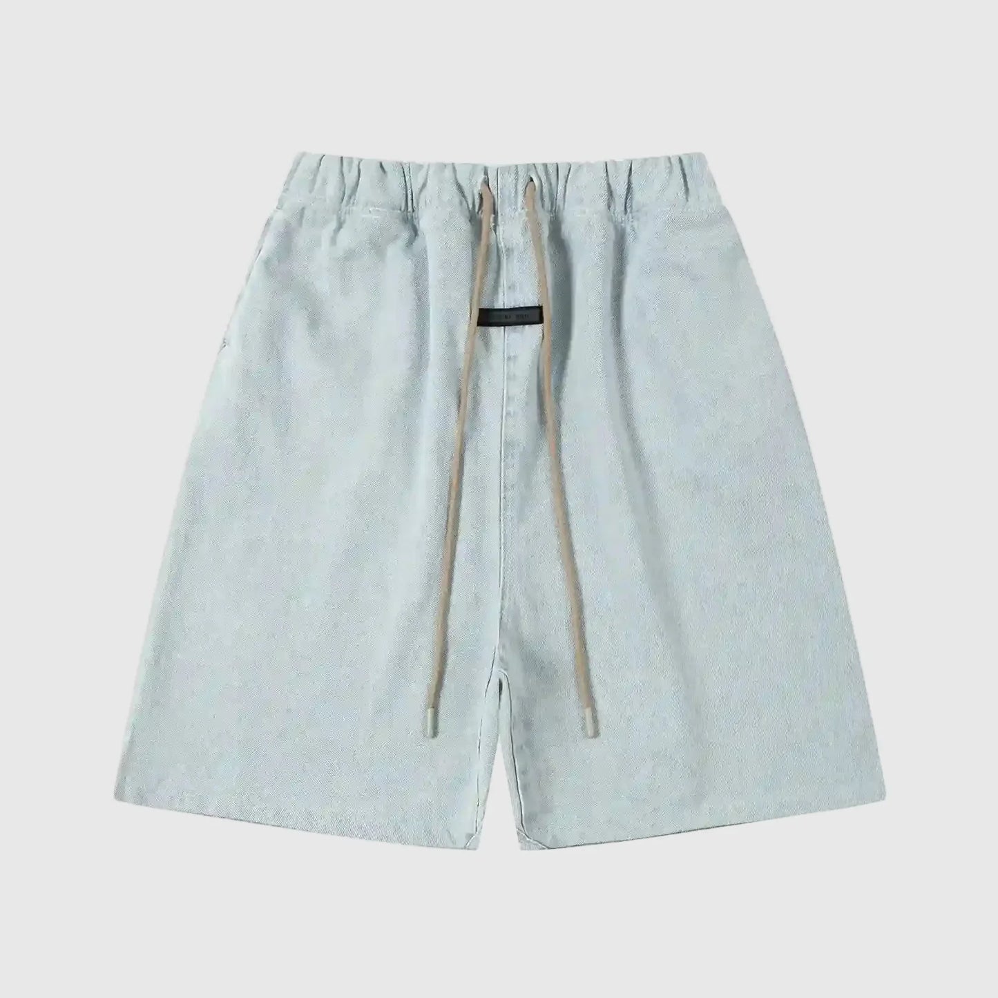 Fear of God Essentials denim blue fleece shorts with tonal logo and relaxed vintage fit