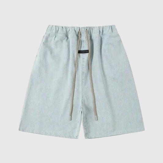 Fear of God Essentials denim blue fleece shorts with tonal logo and relaxed vintage fit