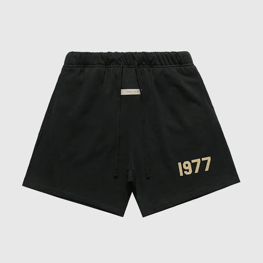 Fear of God Essentials black fleece shorts with tonal logo and relaxed silhouette