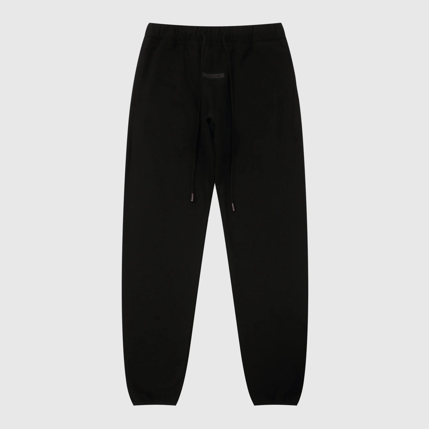 Essentials black elevated core sweatpants by Fear of God front view