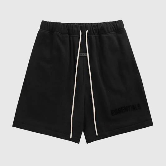 Fear of God Essentials black fleece shorts with tonal logo and oversized fit