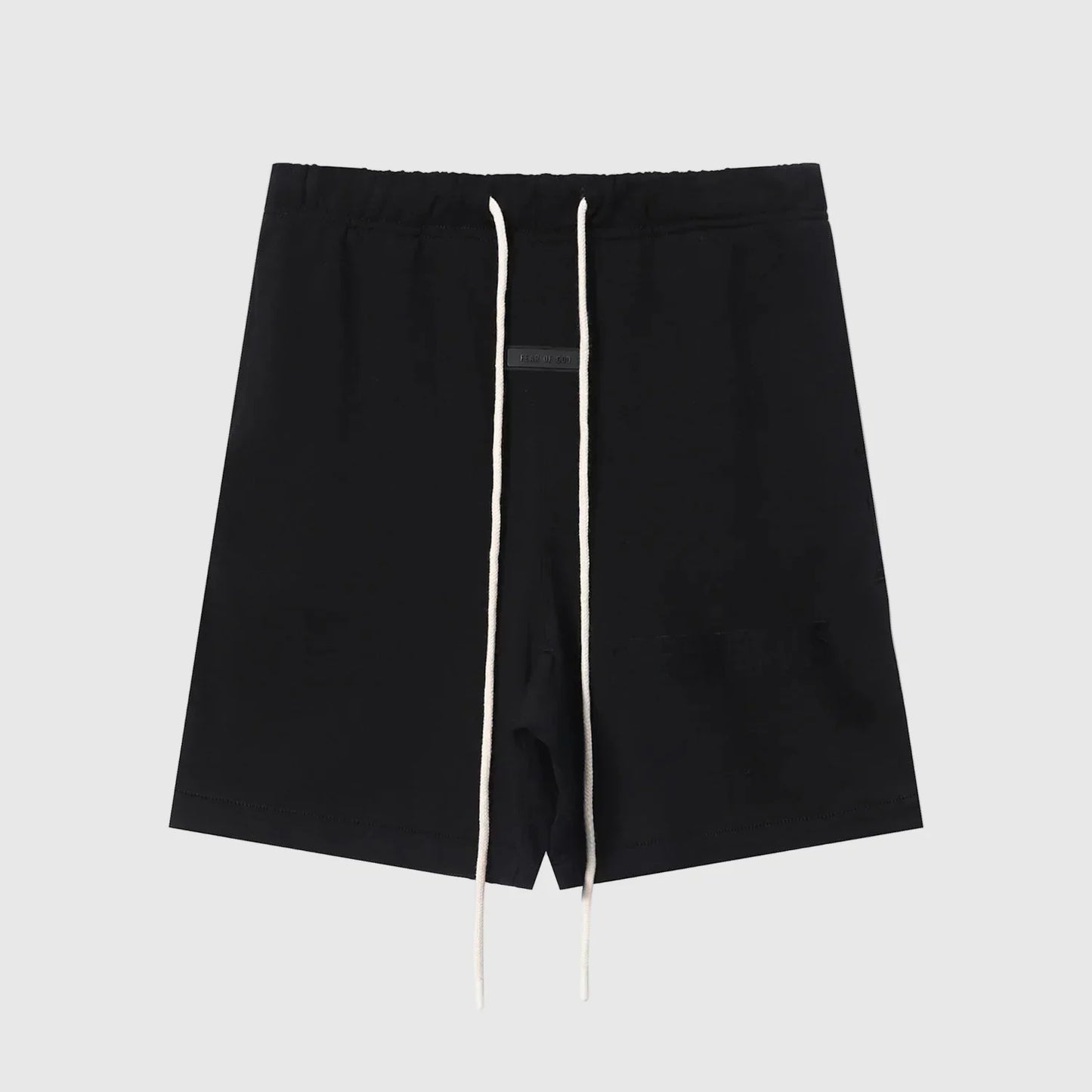 Fear of God Essentials black fleece shorts with tonal logo and relaxed silhouette
