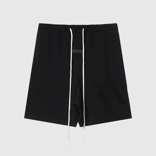 Fear of God Essentials black fleece shorts with tonal logo and relaxed silhouette