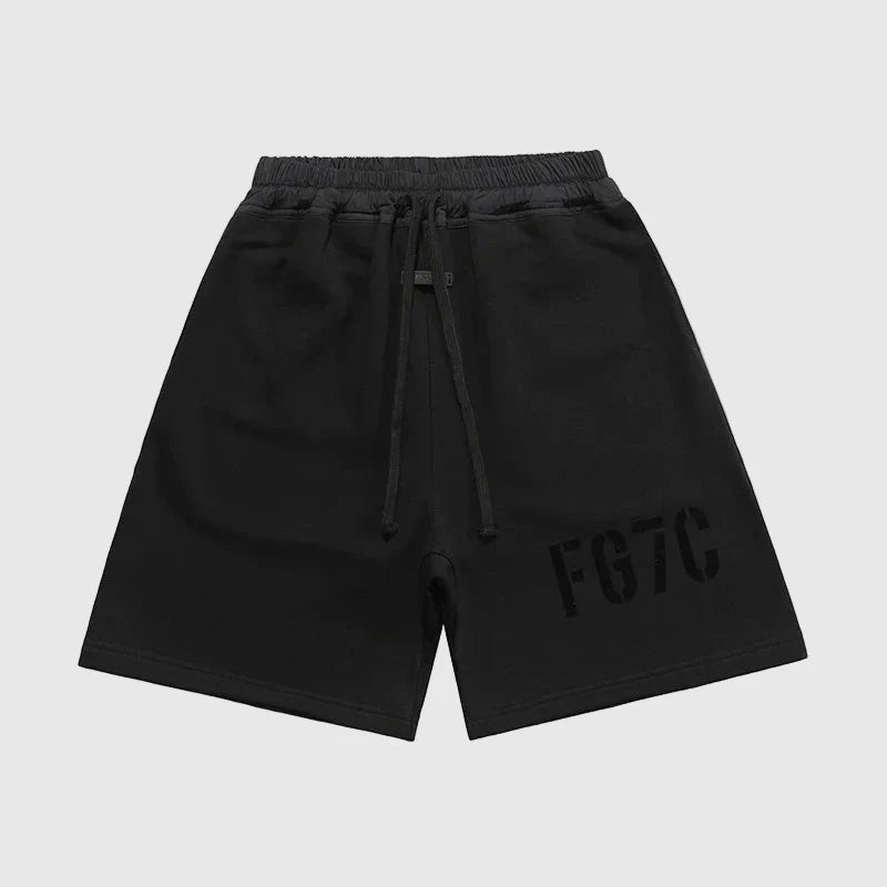 Fear of God Essentials black fleece shorts with tonal branding and relaxed streetwear fit