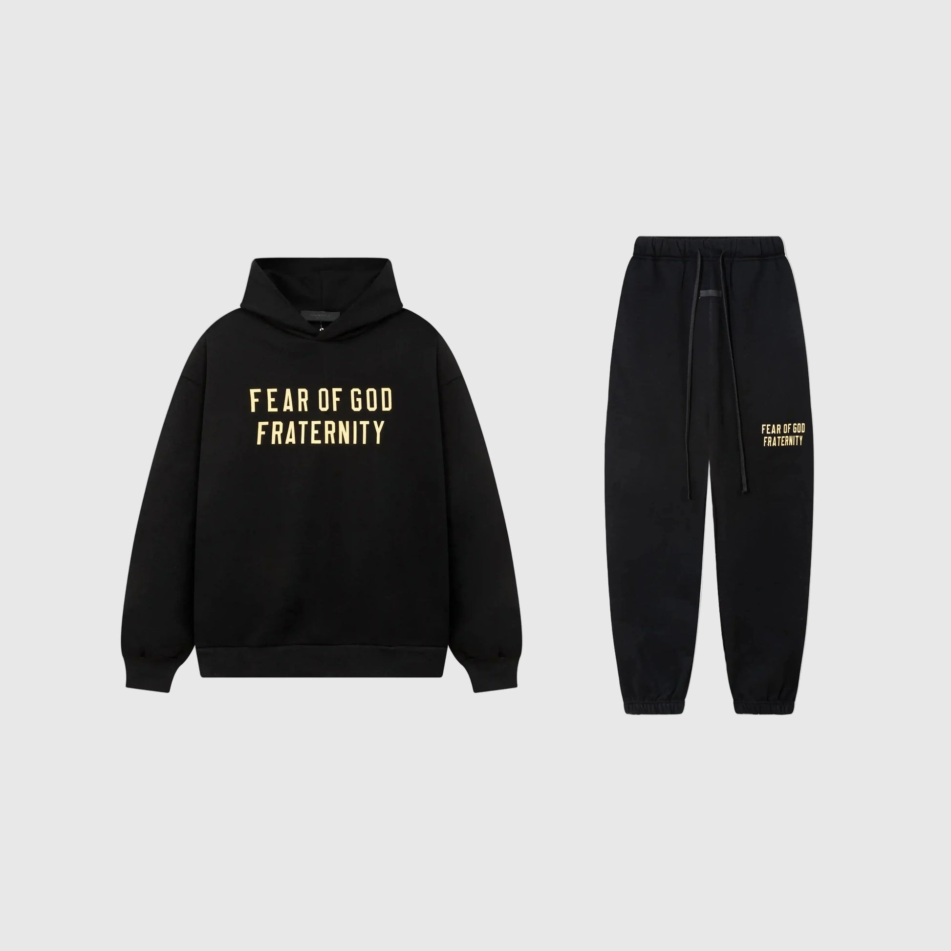 Fear of God Essentials black tracksuit front view hoodie and joggers