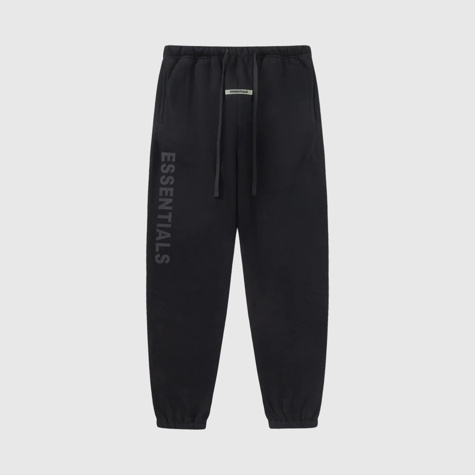 Essentials black relaxed core fleece sweatpants by Fear of God front view