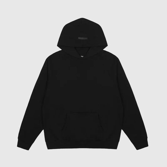 Fear of God Essentials black hoodie front view with minimalist rubberized bar branding