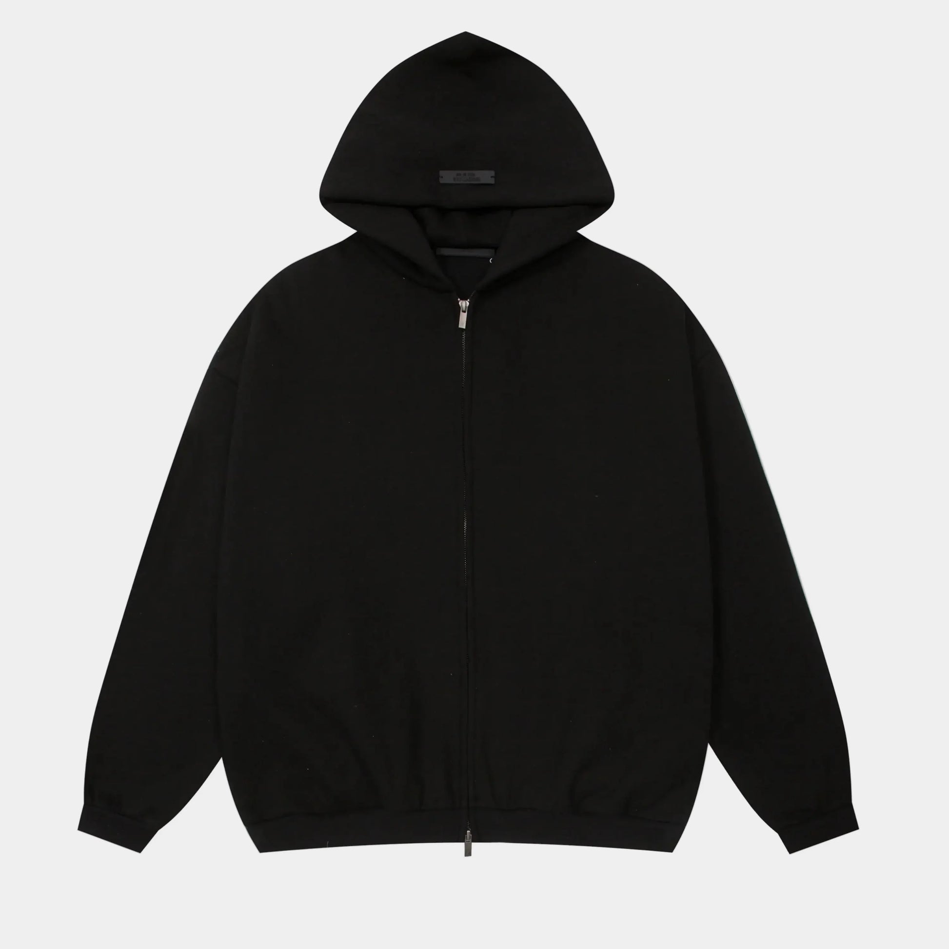 Fear of God Essentials black zip fleece hoodie front view with minimalist branding