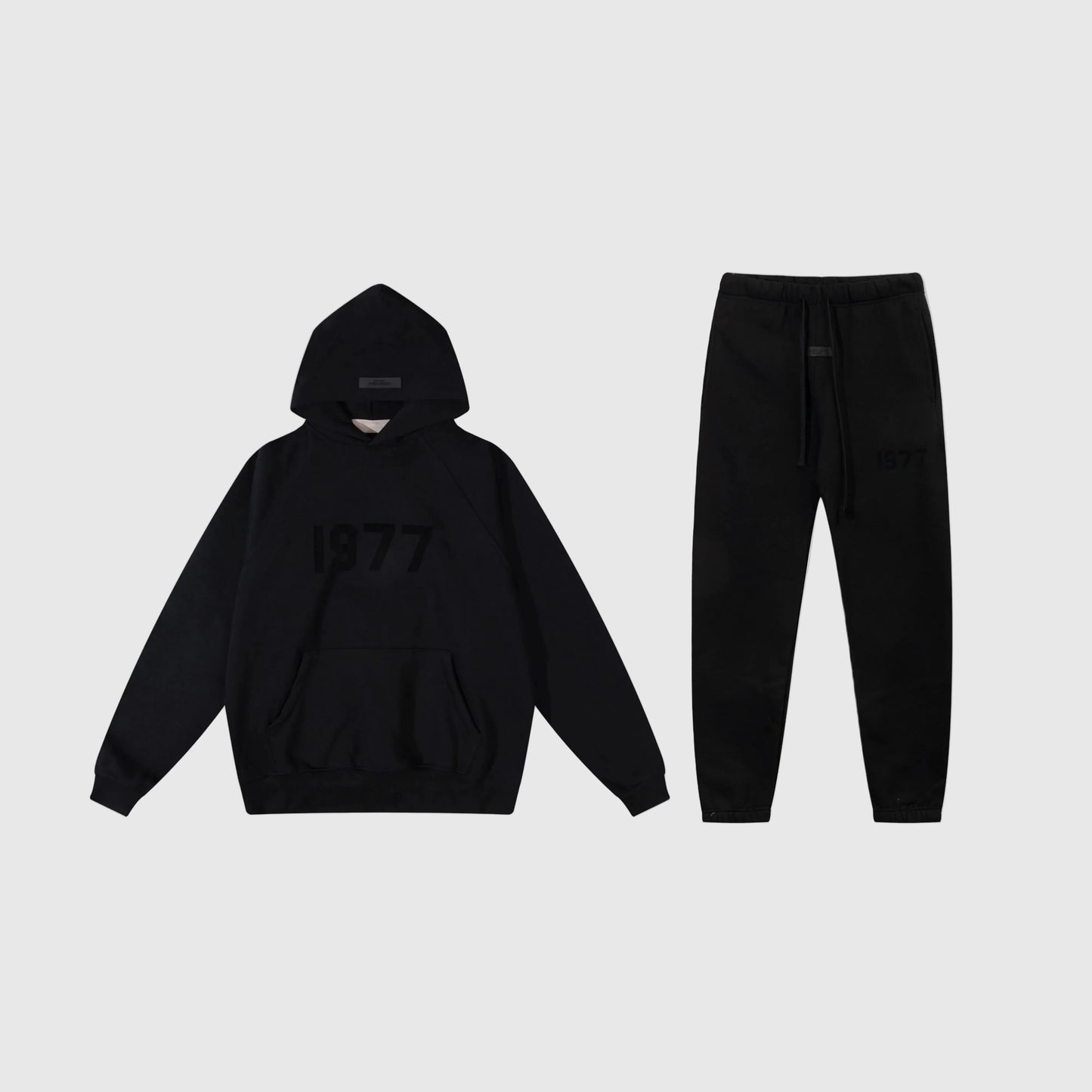 Fear of God Essentials black tracksuit front view hoodie and joggers