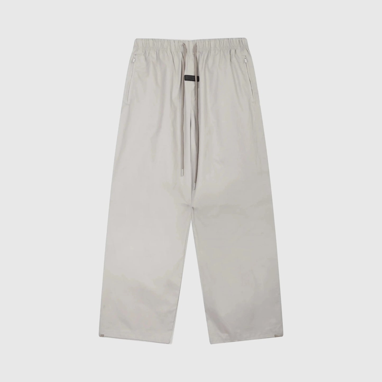 Essentials heathered grey core street fleece sweatpants by Fear of God front view