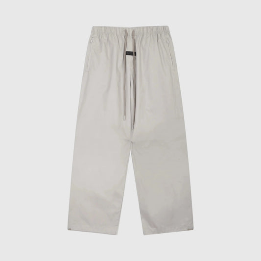 Essentials heathered grey core street fleece sweatpants by Fear of God front view