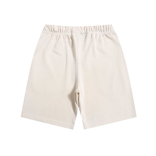 Fear of God Essentials Cloud Dance fleece shorts relaxed fit side view