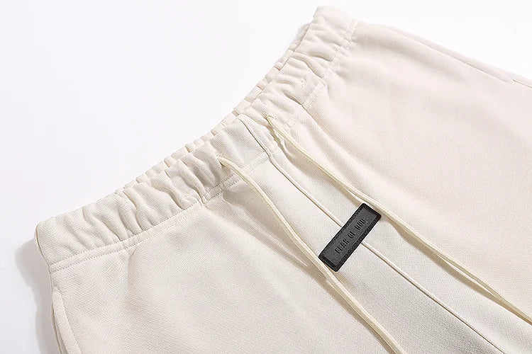 Essentials Cloud Dance shorts tonal rubberized logo leg detail