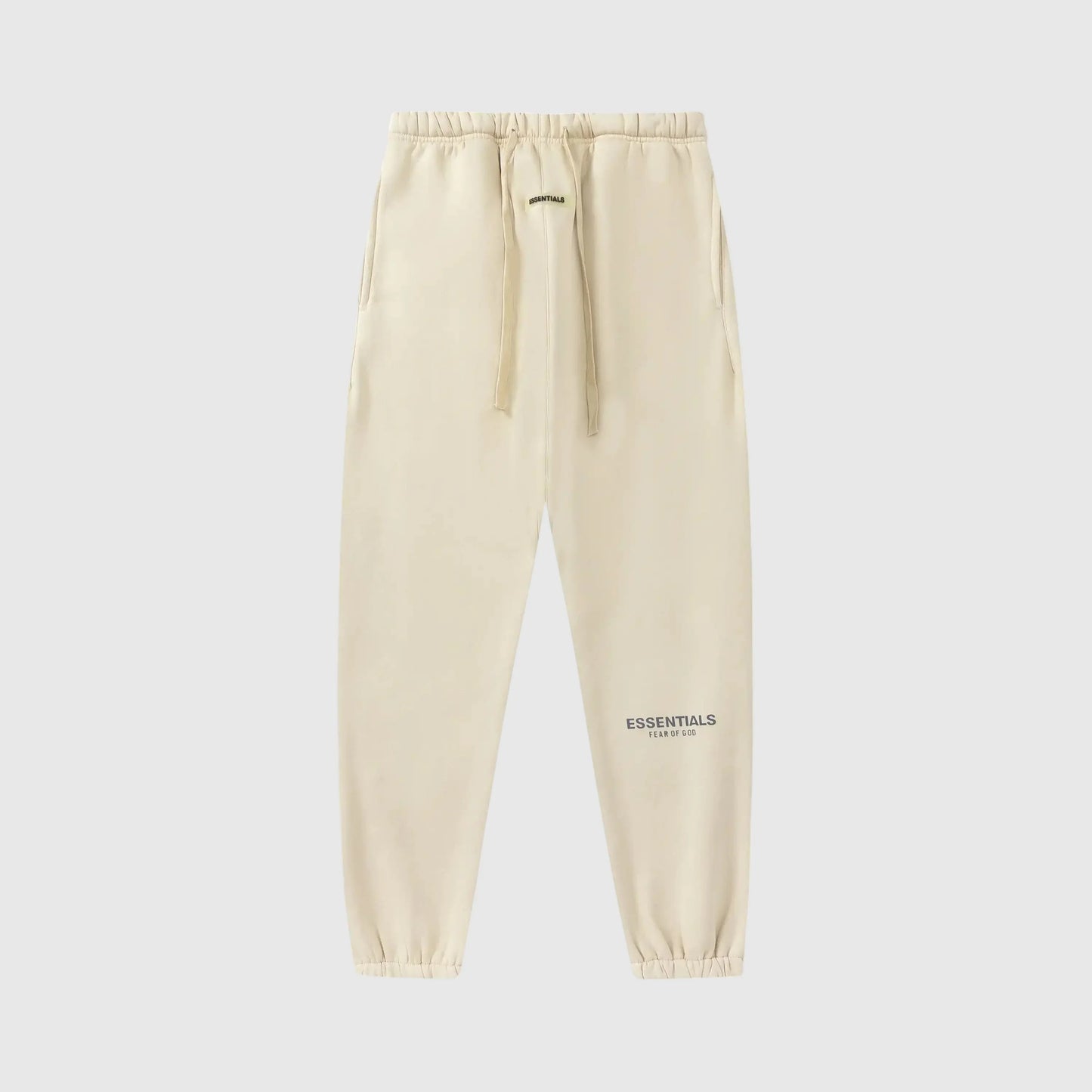 Essentials light cream core street fleece sweatpants by Fear of God front view