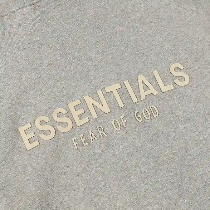 Essentials Light Heather oatmeal zip-up hoodie back view – Fear of God