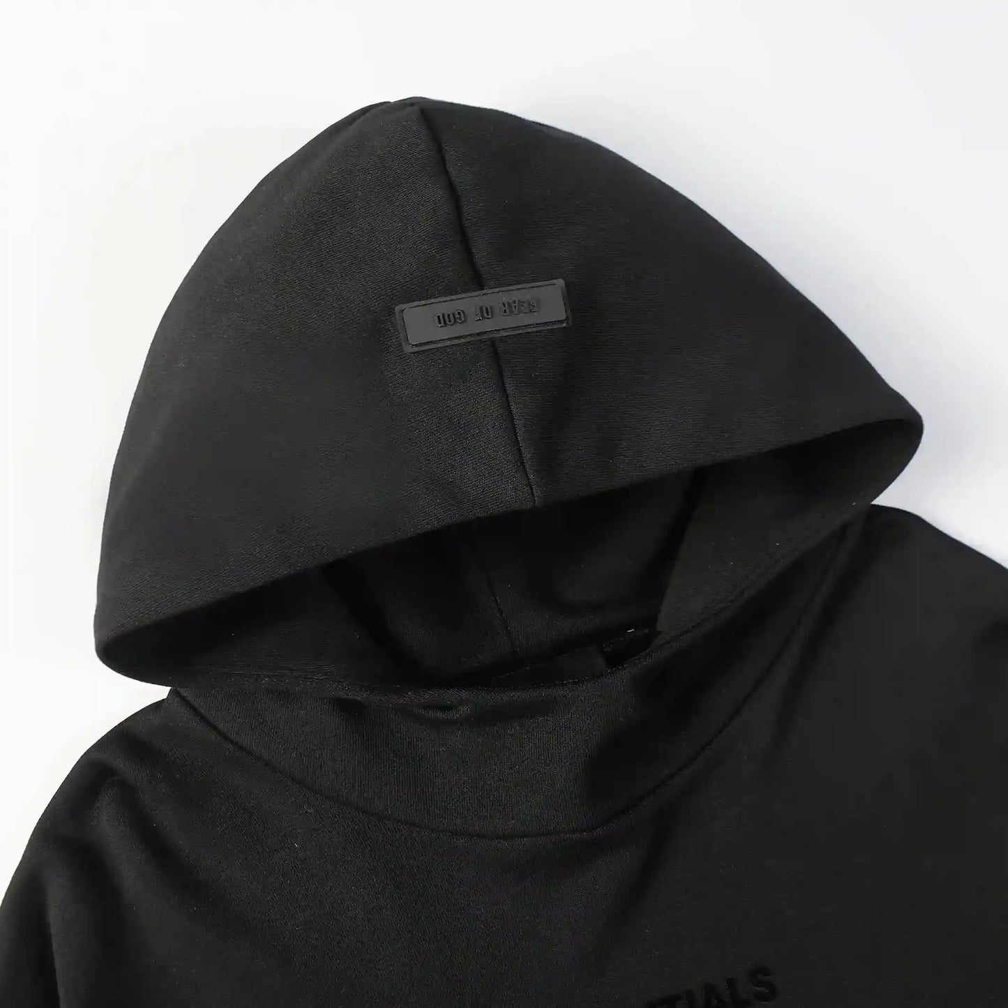 essentials black hoodie front view minimalist design