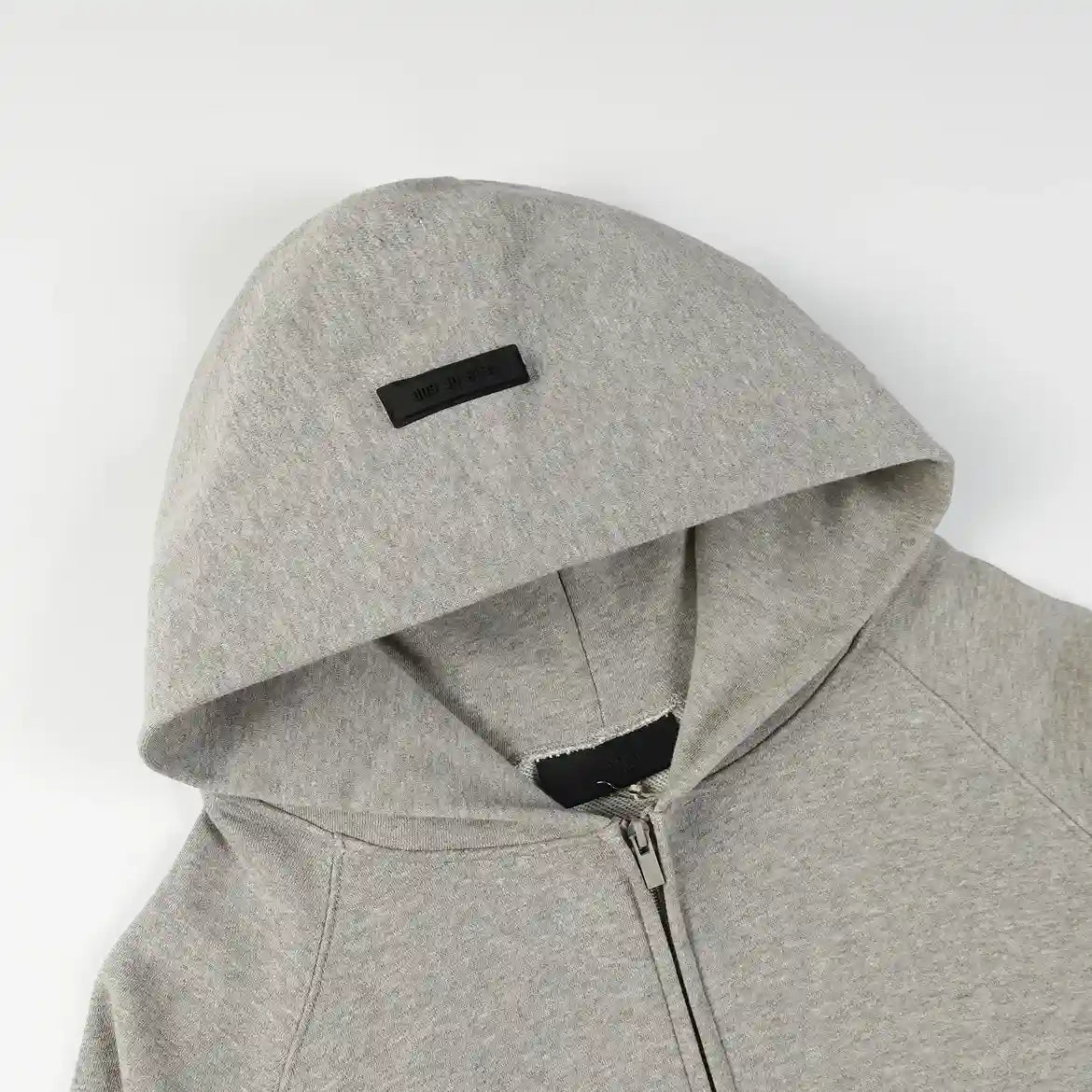 Essentials Light Heather oatmeal zip-up hoodie top view – Fear of God