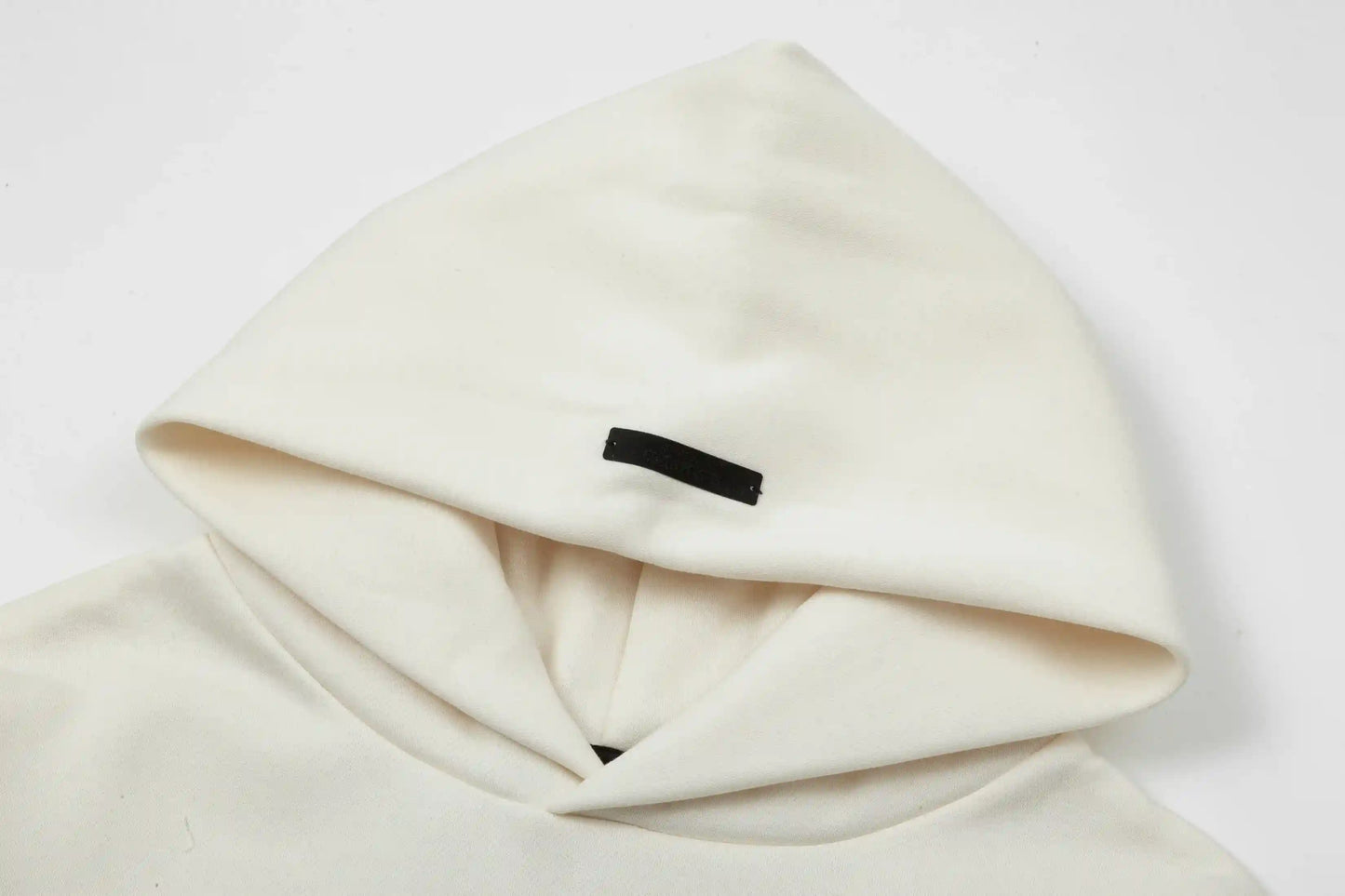 essentials eggshell hoodie front minimalist design