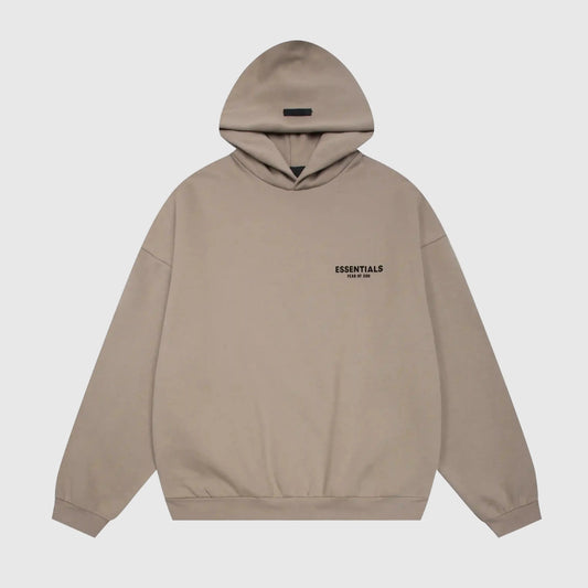 Fear of God Essentials sandrift hoodie front view with rubberized Black Bar branding