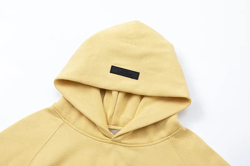 essentials garden yellow hoodie front view minimalist design