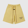 Fear of God Essentials Garden Yellow fleece shorts with drawstring waist and tonal logo