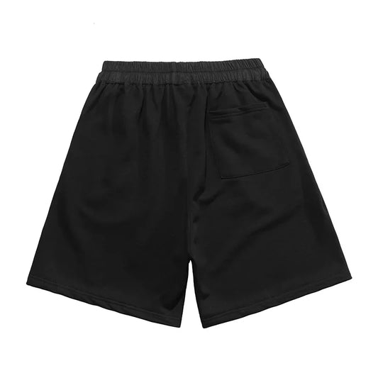Fear of God Essentials Black fleece shorts relaxed fit side view