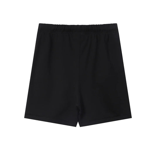 Fear of God Essentials black fleece shorts with tonal logo and relaxed silhouette