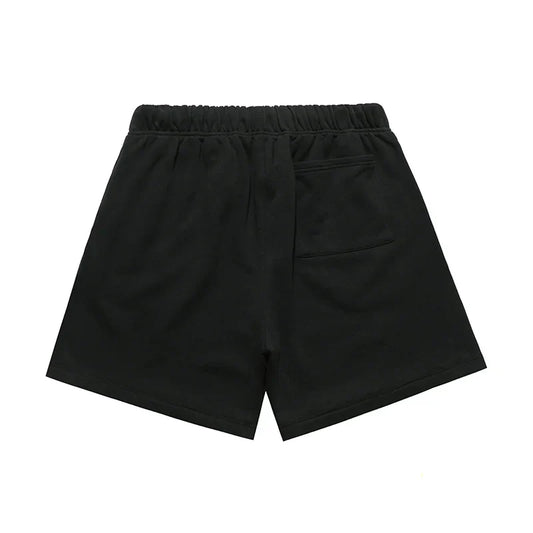 Fear of God Essentials black fleece shorts with tonal logo and relaxed silhouette