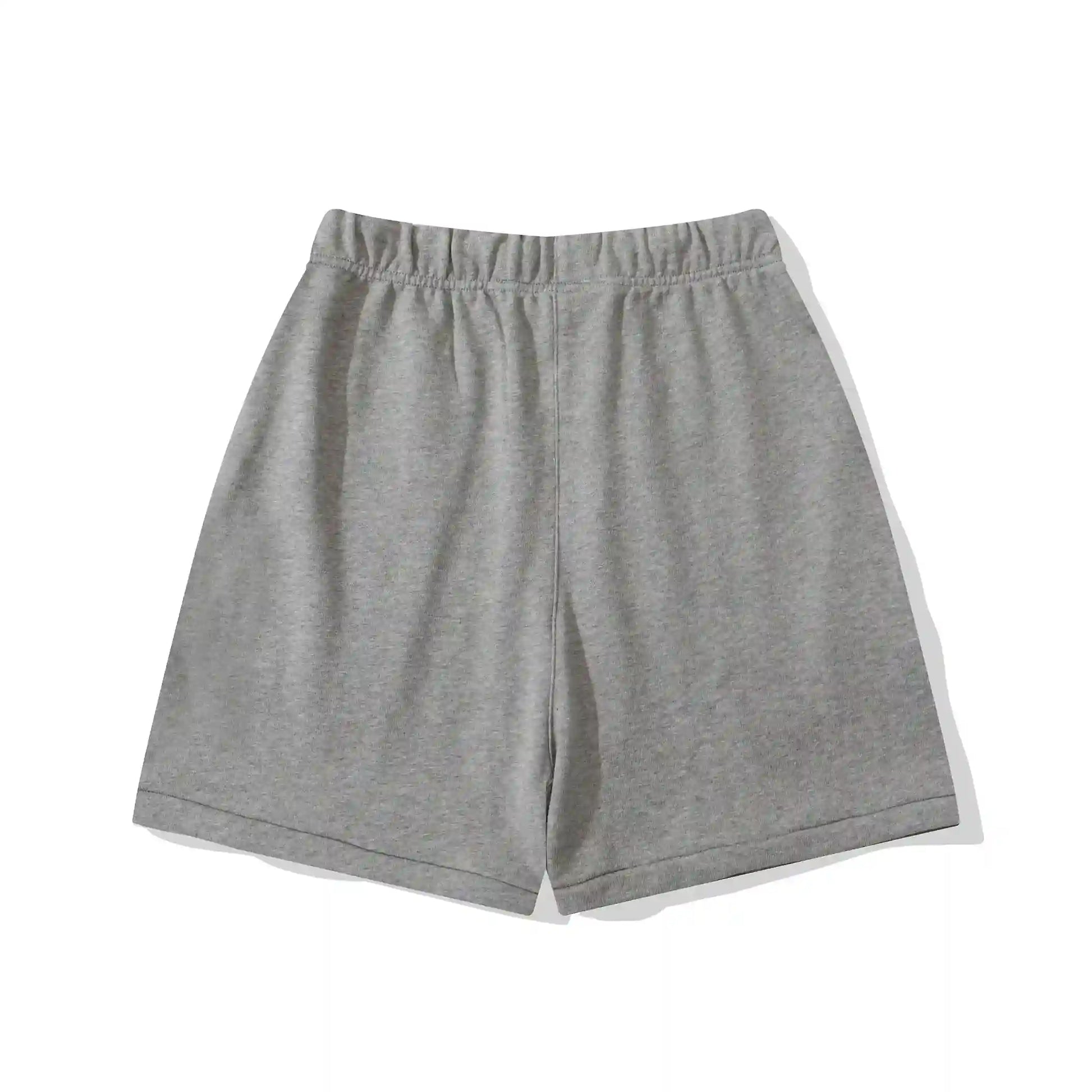 Fear of God Essentials light heather oatmeal fleece shorts with relaxed fit and tonal branding