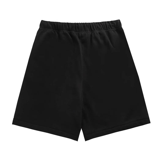 Fear of God Essentials black fleece shorts with tonal logo and oversized fit