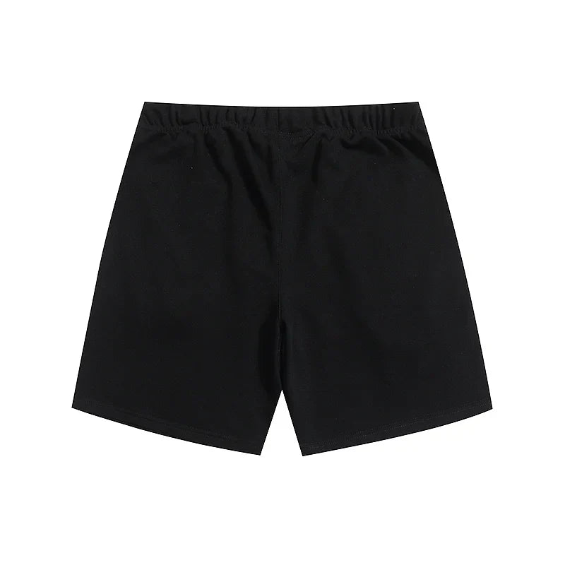 Fear of God Essentials Black fleece shorts relaxed fit side view