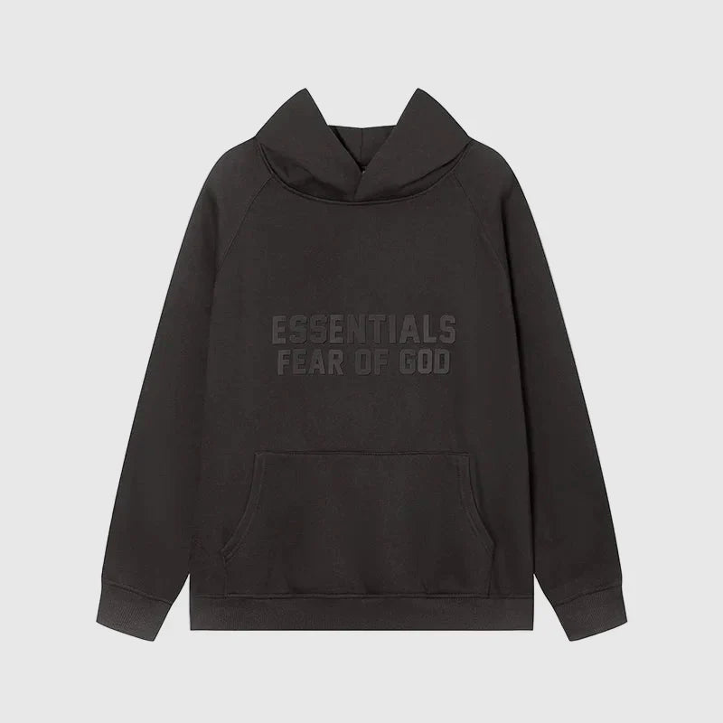 Fear of God Essentials black hoodie front view with rubberized black bar branding