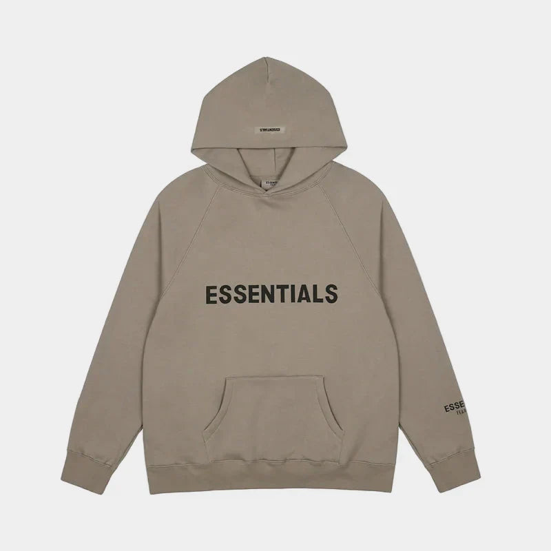 Fear of God Essentials light taupe hoodie front view with rubberized Black Bar branding