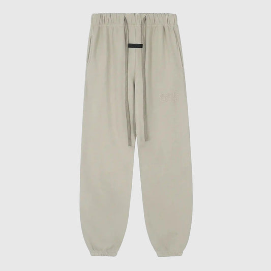Essentials heathered grey relaxed street fleece sweatpants by Fear of God front view
