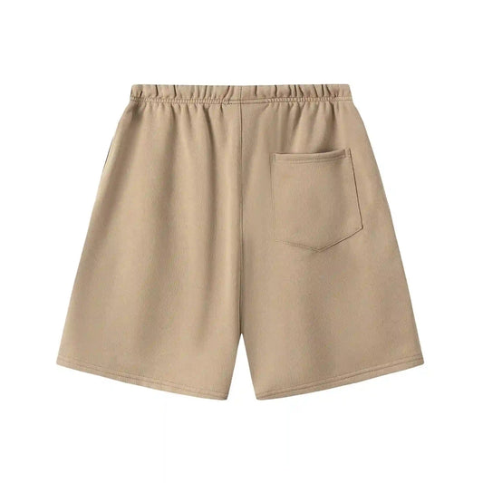 Fear of God Essentials Calm Shell fleece shorts in beige with tonal branding and relaxed silhouette