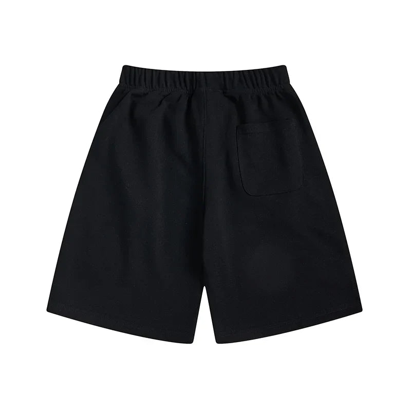 Fear of God Essentials black fleece shorts with tonal logo and core streetwear fit