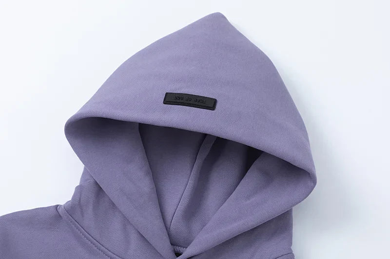 essentials pastel purple hoodie front view minimalist design