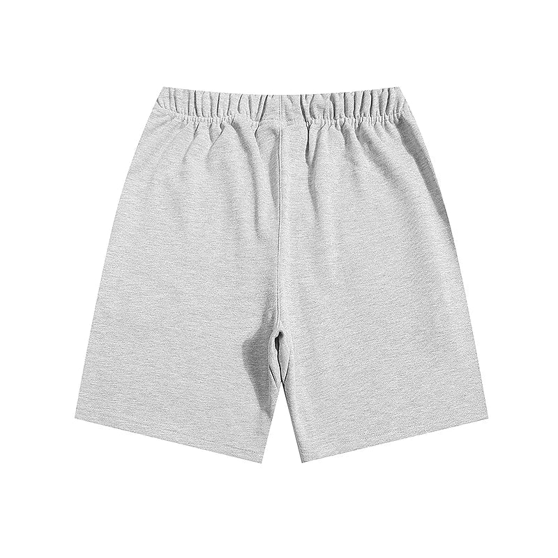Fear of God Essentials Light Heather Oatmeal fleece shorts relaxed fit side view
