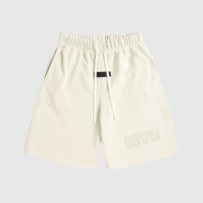 Fear of God Essentials Cloud Dance shorts in soft white fleece with relaxed fit and tonal branding
