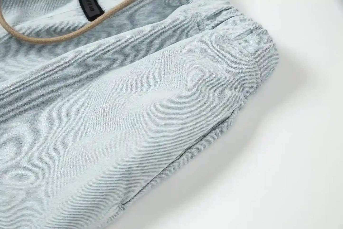 Fear of God Essentials denim blue fleece shorts with tonal logo and relaxed vintage fit