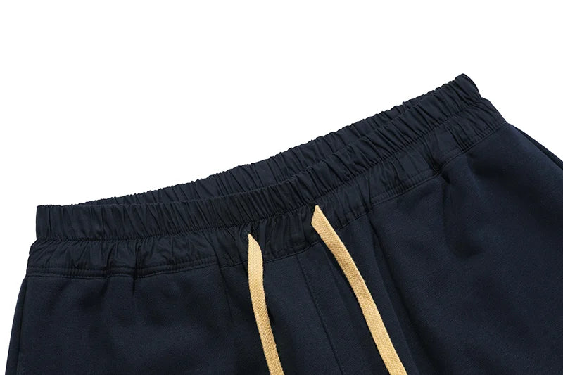 Essentials Blue shorts tonal rubberized logo leg detail
